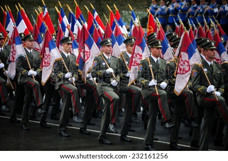 SERBIA, BELGRADE - OCTOBER 16, 2014: Echelon of Serbian Army war flags practiced ceremonial step during Military Parade commemorating the 70th anniversary of the liberation of Belgrade
