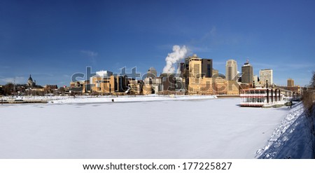 Panoramic of snow and ice covered Mississippi River with Saint Paul skyline, Minnesota, USA