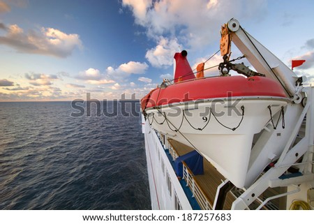 Life raft on the side of a cruise ship.