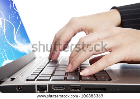 Close-up of female hands typing on laptop computer keyboard
