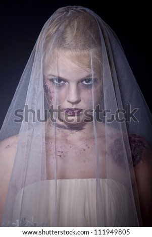 Halloween: Horror scene of a corpse bride standing. Shot in studio.