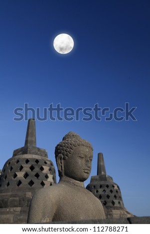 Shot of statue and stupa at borobudur temple Yogyakarta Java Indonesia Shot of statue and stupa at borobudur temple Yogyakarta Java Indonesia