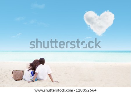 Enjoying honeymoon at white sand beach with love cloud Enjoying honeymoon at white sand beach with love cloud