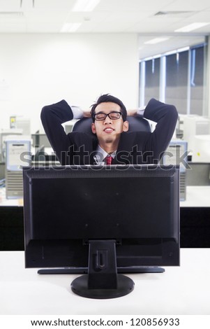 Businessman relax in front of computer at office