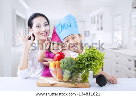 Happy family with vegetable at home
