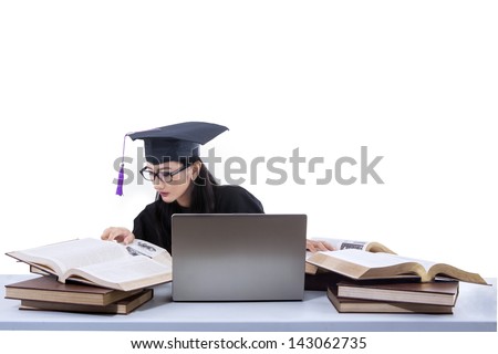 Busy female graduate reading books on white background
