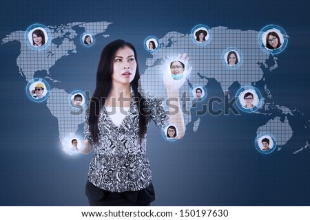 Asian Businesswoman with social networking map over digital world map