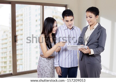 Young businesswoman showing her product on a tablet