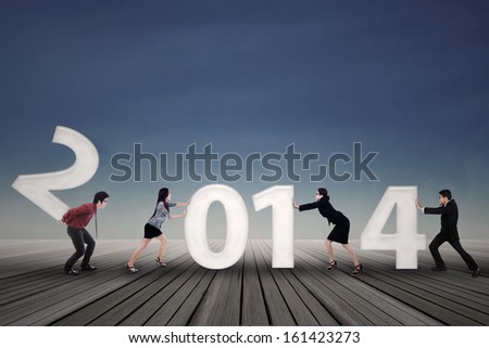 New business arrangement concept with bussinesspeople arrange new year of 2014