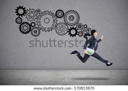 Businesswoman is running by holding business paper with gears