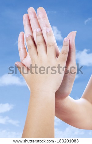 Closeup of hands clapping for celebrating success together