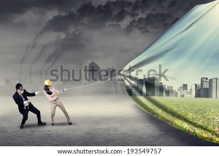 Engineer try to save environment by pulling a banner of new green city Engineer try to save environment by pulling a banner of new green city