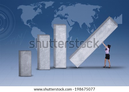 Businesswoman is building profit chart on blue world map background