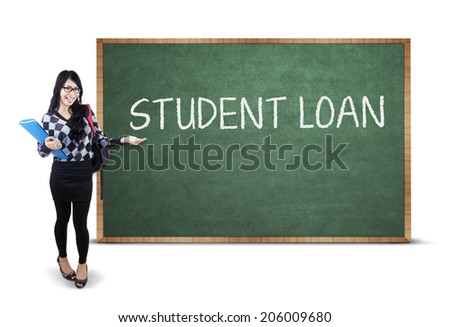Female student standing next to student loan text. isolated on white