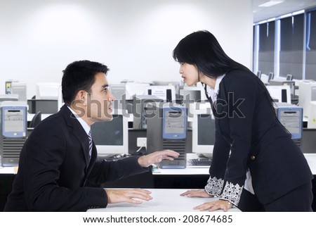 Businesspeople in an Office Fighting and Yelling at Each Other