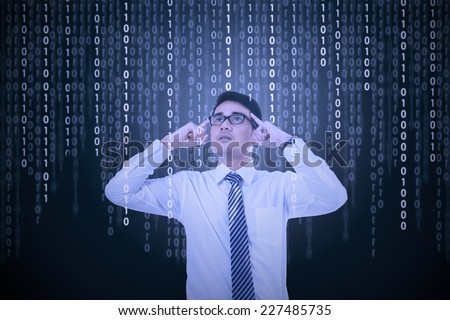 Confused man look and try to get information from binary code