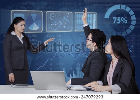 Portrait of female entrepreneur lead a business meeting and let her team member to ask