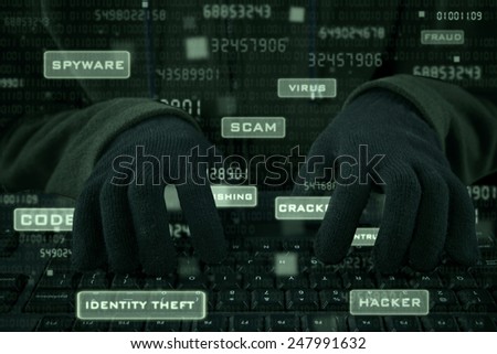 Hacker hands wearing gloves typing on keyboard to steal user ID