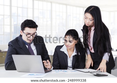 Portrait of three businesspeople are busy working in the office and make a business plan