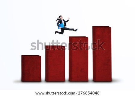 Businesswoman is running over an upward business graph