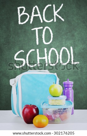 Close up of school lunch for child back to school, shot in the classroom with blackboard background
