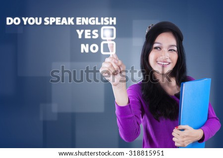 Image of beautiful teenage girl learn english speaking and touching a text of Do You Speak English?