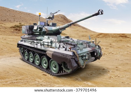 Image of a modern military tank with cannon on the field
