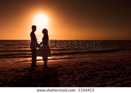 couple holding hands on beach. stock photo : Couple holding