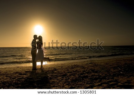 couple kissing. couple kissing at sunset