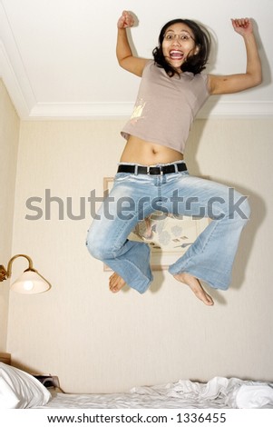 woman jumping around in her room
