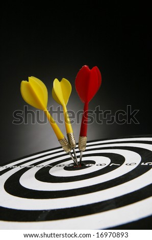 Three darts on bull\'s eye of a dart board