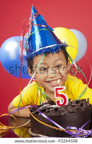 Asian sibling celebrating fifth  birthday