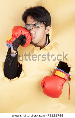 Asian businessman hit his face with boxing glove