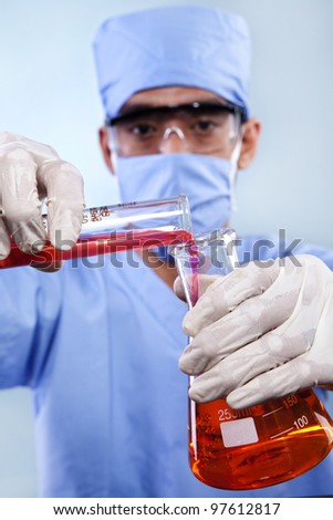 Doctors wearing mask working with chemicals in a laboratory