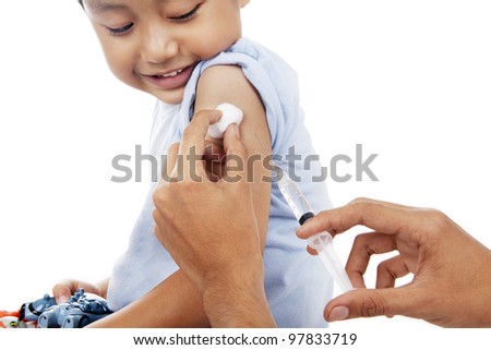 Little child have a vaccination shot in studio isolated on white