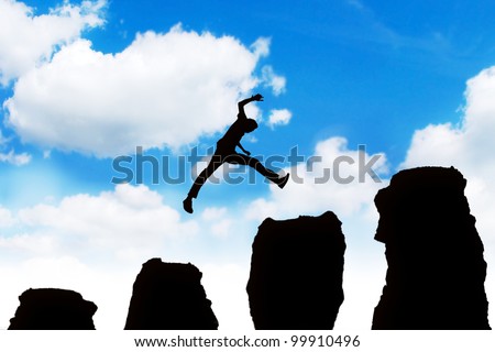 Silhouette of a successful businessman jumping off obstacles to reach the top of his carrier.