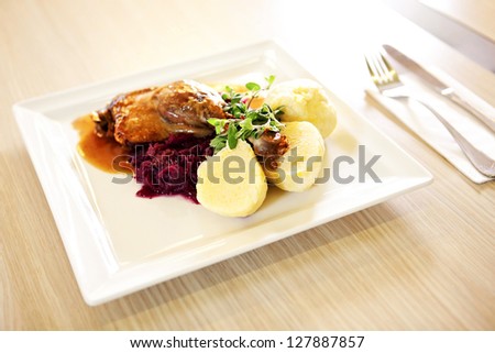 Roast duck with red cabbage and potato dumplings