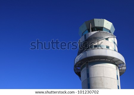Airport tower at Christchurch airport in New Zealand against blue sky.