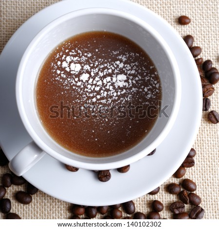 coffee cup with roasted beans