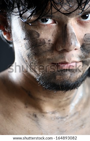 young Thai soldier face with jungle camouflage