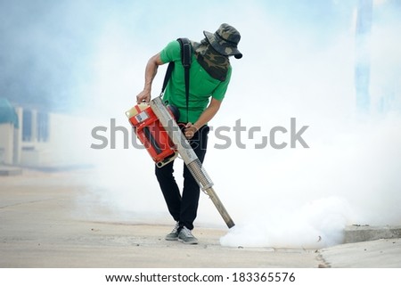 CHONBURI, THAILAND - MARCH 24: Unidentified man fogging chemical to anti mosquitos on March 24, 2014 in Chonburi, Thailand.