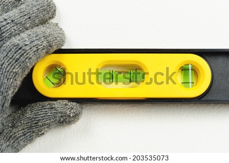 technician using spirit level to checking the level