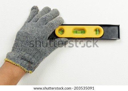 technician using spirit level to checking the level