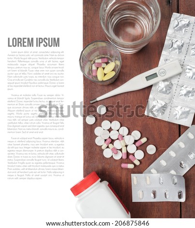 variety of medical object on wooden plank background