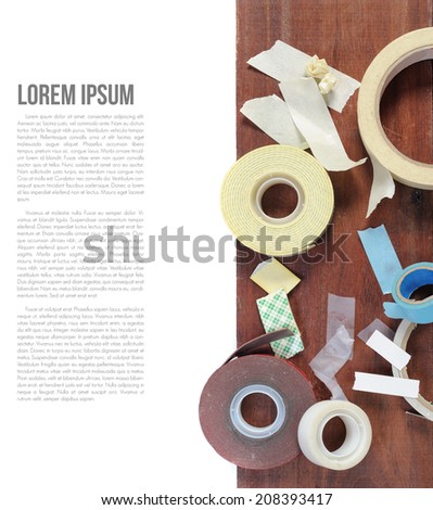 many type of adhesive tape on wooden plank