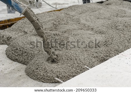 mixed concrete pouring at construction site