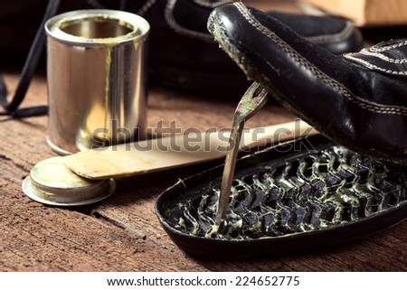 applying rubber adhesive to the shoe, shoe repair