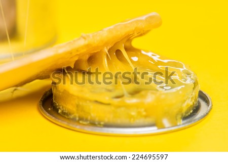 closeup rubber adhesive on yellow background
