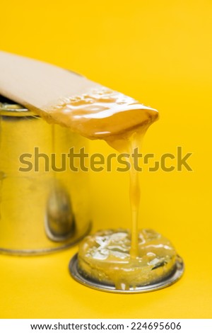 closeup rubber adhesive on yellow background