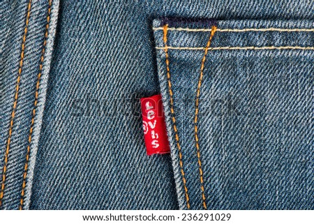 BANGKOK, THAILAND - DECEMBER 09 2014: Close up of the LEVI\'S red label on the back pocket of denim jeans. LEVI\'S is a brand name of Levi Strauss and Co, founded in 1853.